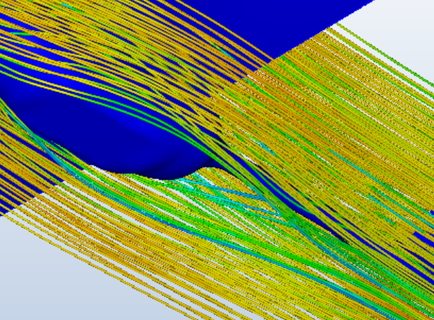 Autodesk CFD post-processing screenshot showing a dense field of curved, color-graded streamlines running diagonally across the frame, with a dark-blue low-value region where the streamlines bunch and curve sharply.